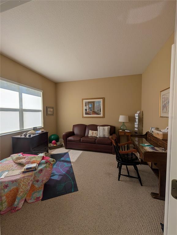 343 Marsh Creek Road Venice, FL 34292 - Photo 18 of 30 a living room with furniture and a window