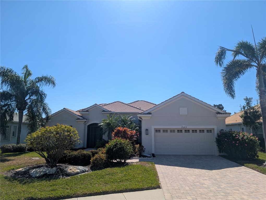 343 Marsh Creek Road Venice, FL 34292 - Photo 2 of 30 a view of a house with a yard and potted plants