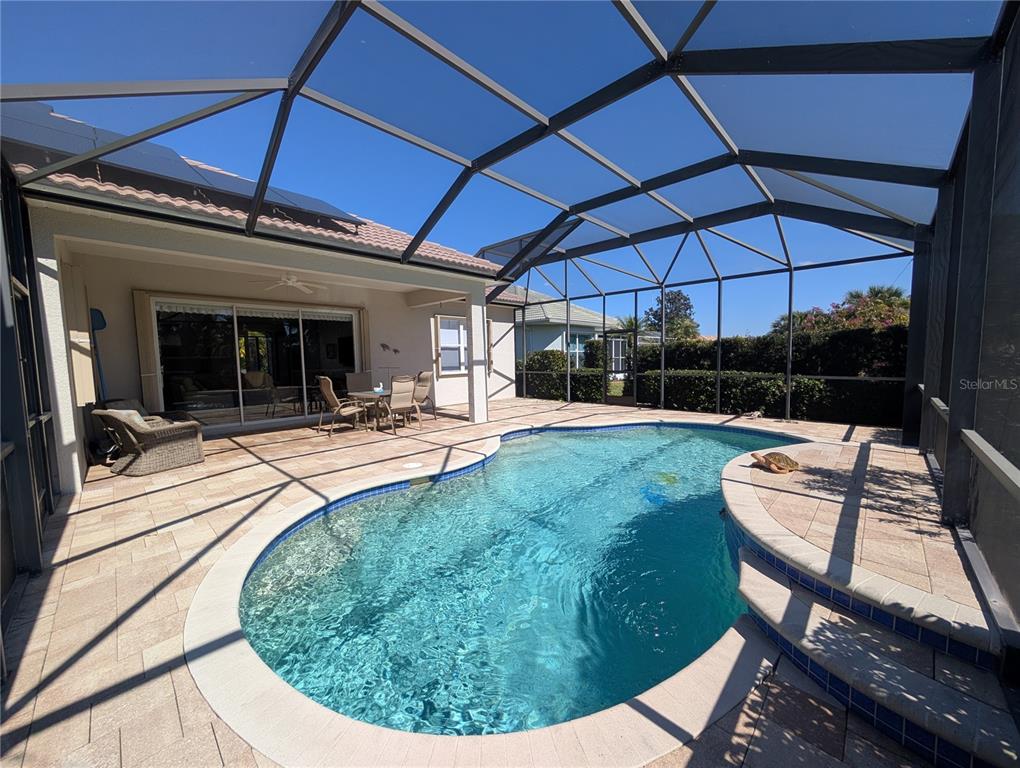 343 Marsh Creek Road Venice, FL 34292 - Photo 24 of 30 a view of a backyard with sitting area and furniture