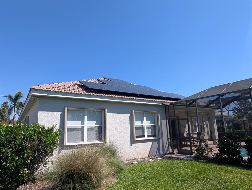 343 Marsh Creek Road Venice, FL 34292 - Photo 27 of 30 a front view of a house with a garden