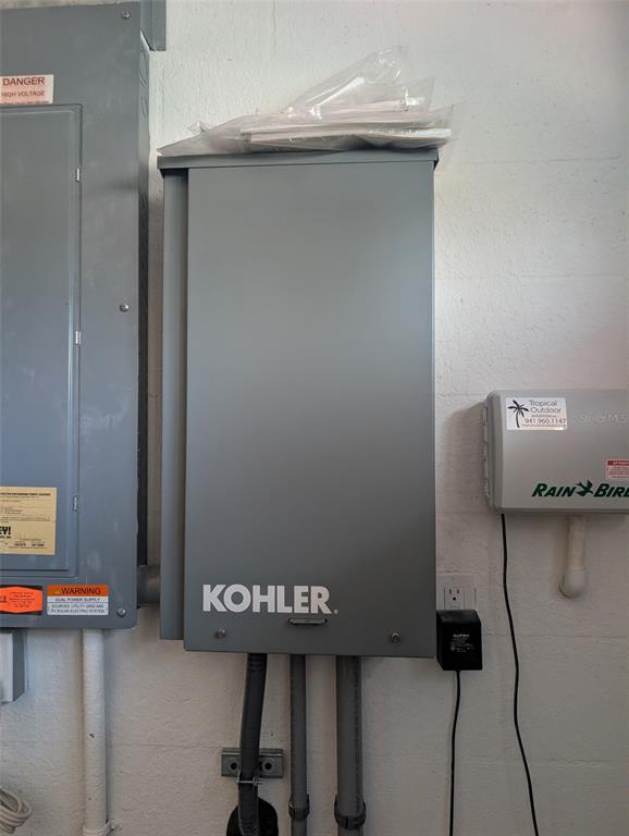 343 Marsh Creek Road Venice, FL 34292 - Photo 29 of 30 a view of storage and utility room with two washing machine