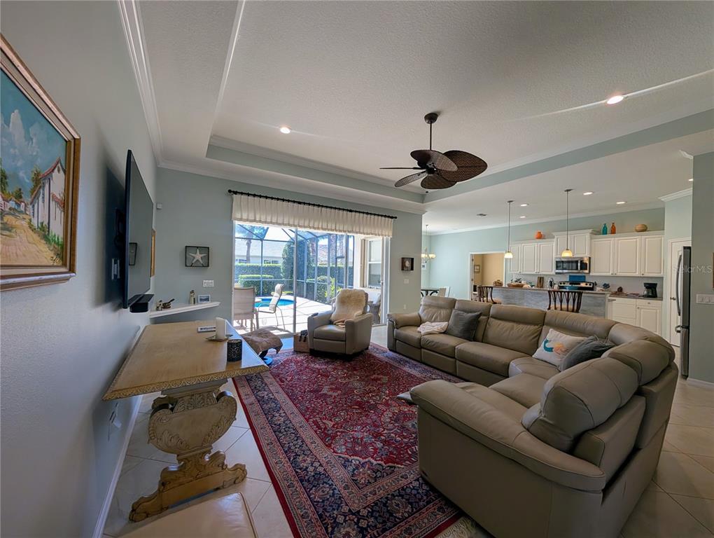 343 Marsh Creek Road Venice, FL 34292 - Photo 4 of 30 a living room with furniture and a large window