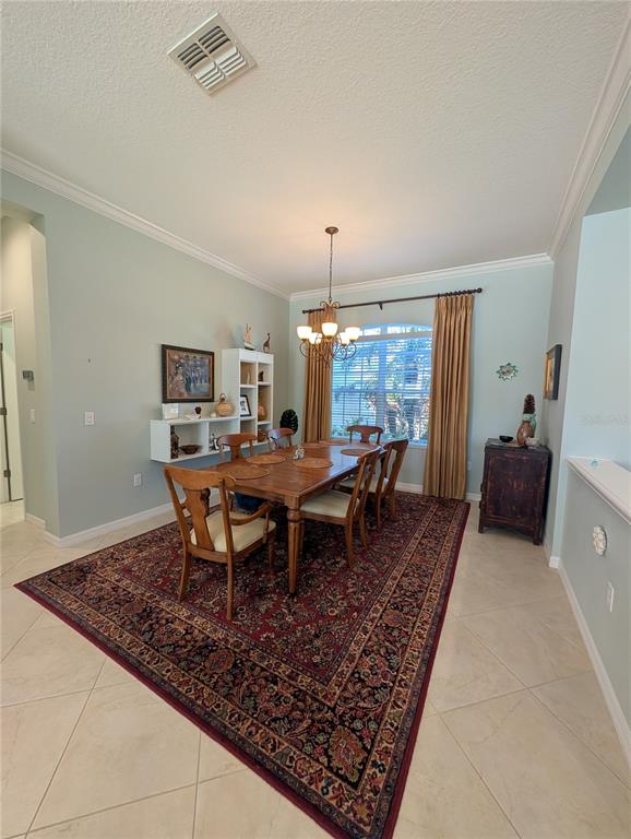 343 Marsh Creek Road Venice, FL 34292 - Photo 7 of 30 a view of a dining room with furniture