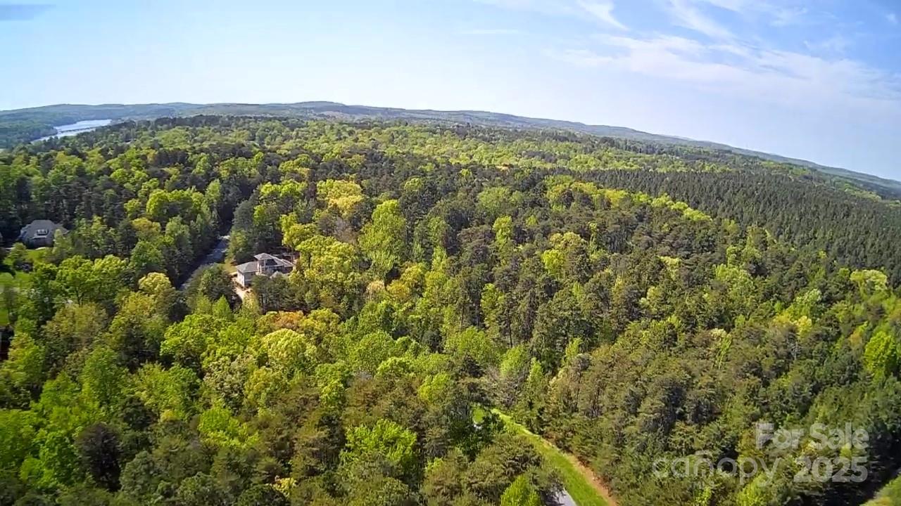 133 Baden View Road Badin Lake, NC 28127 - Photo 13 of 48 a view of a city with lush green forest