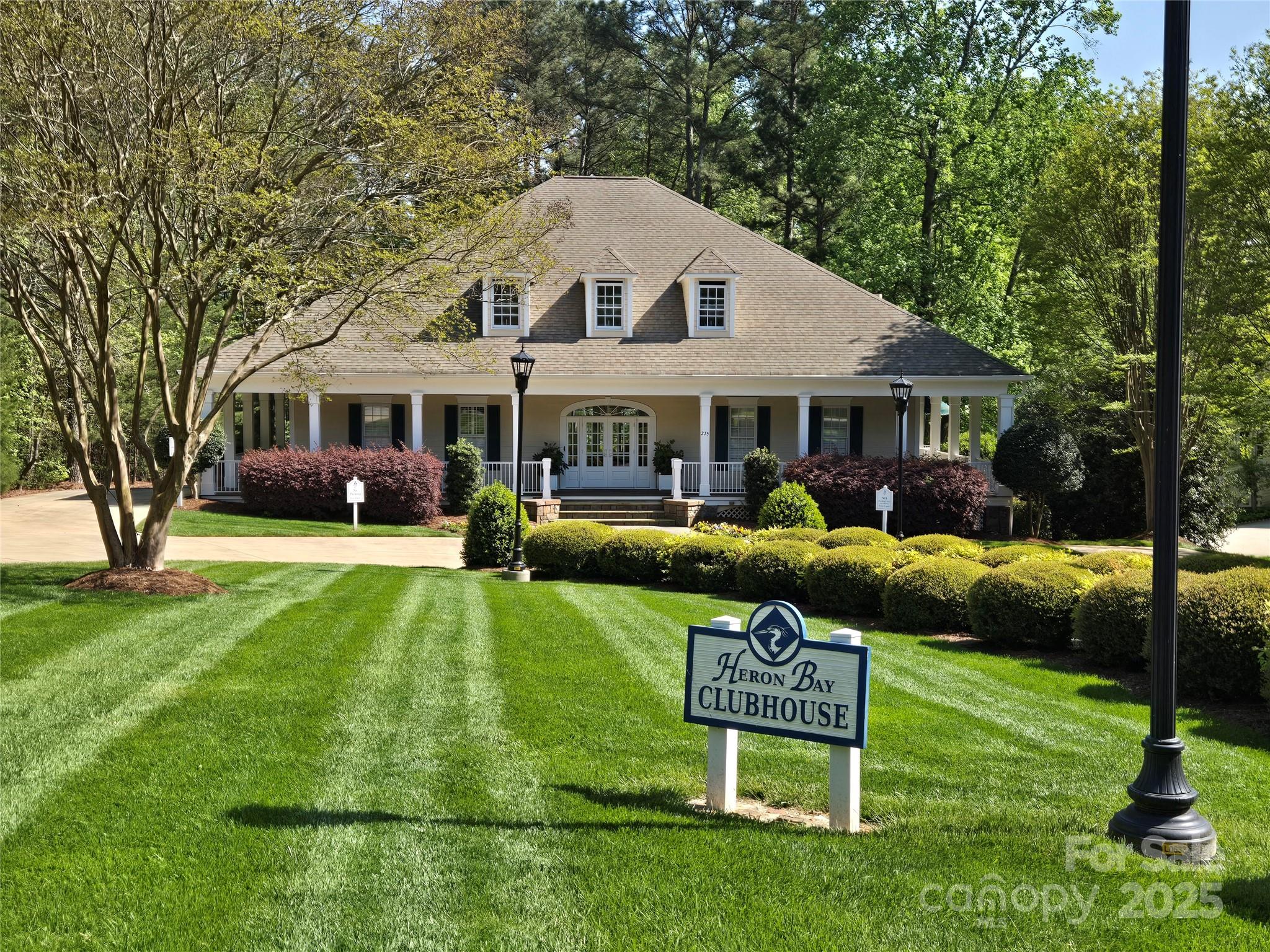 133 Baden View Road Badin Lake, NC 28127 - Photo 37 of 48 a front view of a house with a garden and trees