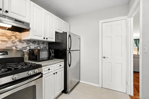 a kitchen with a stove and a refrigerator