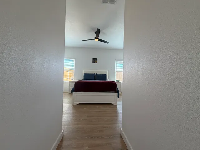 a bedroom with bed and window