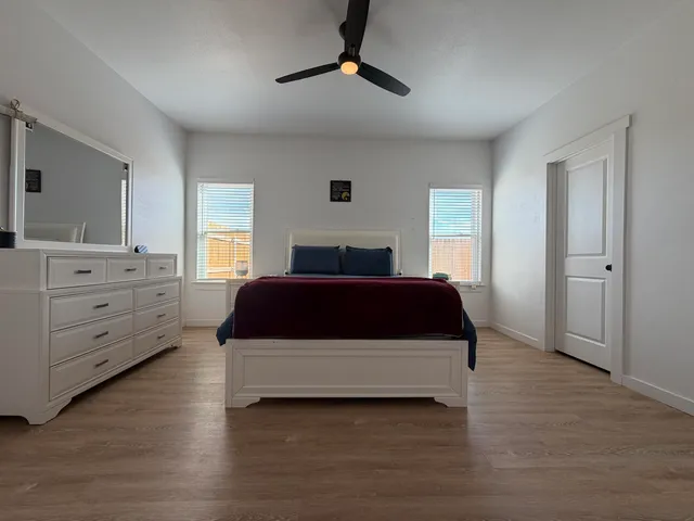 a bedroom with a bed and a dresser
