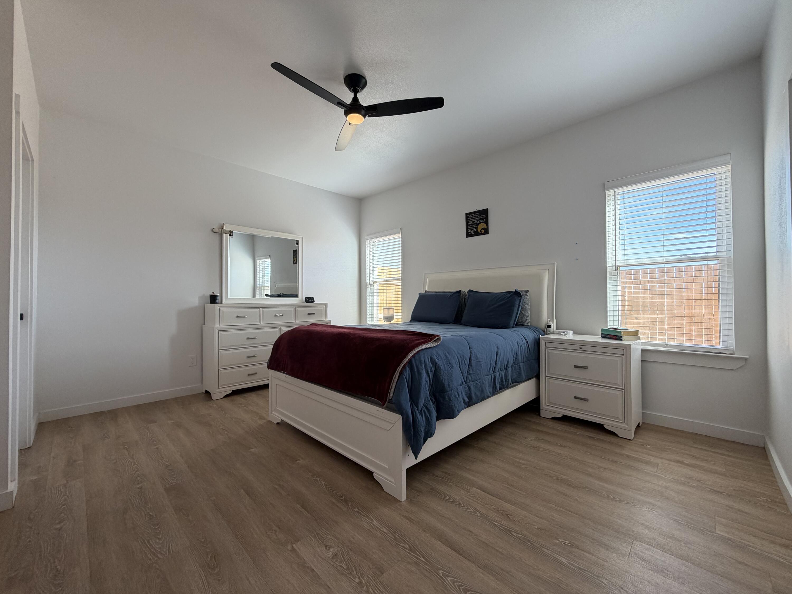 5807 Virginia Avenue Lubbock, TX 79407 - Photo 22 of 26 a spacious bedroom with a bed and a large window