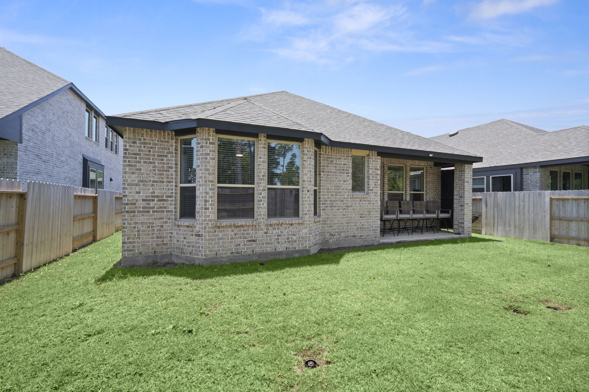 13035 Wandering Rdg Lane Conroe, TX 77302 - Photo 27 of 28 a view of a house with a garden