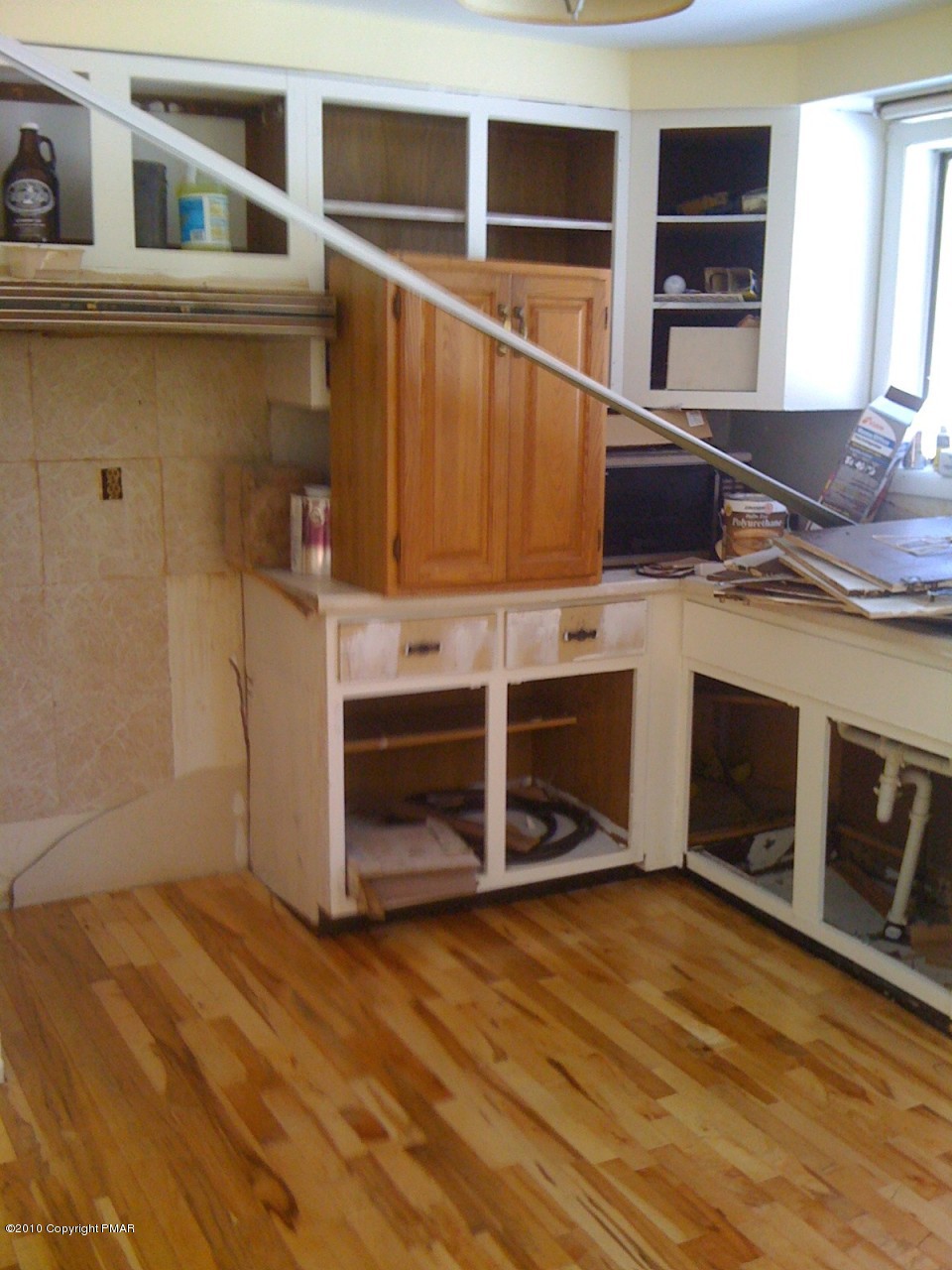 1406 Williams Road Effort, PA 18330 - Photo 3 of 7 a kitchen with wooden cabinets and a stove top oven