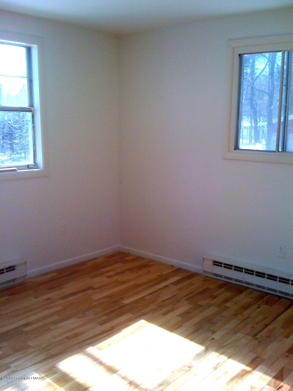 1406 Williams Road Effort, PA 18330 - Photo 7 of 7 a view of a room with wooden floor and window