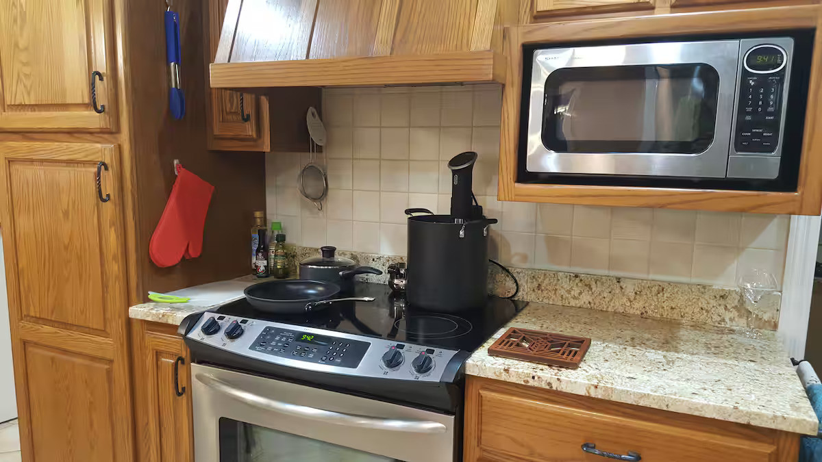 4 Forest Knolls Decatur, IL 62521 - Photo 7 of 32 a kitchen with a stove and a microwave