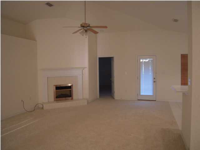 75 Red Maple Court Santa Rosa Beach, FL 32459 - Photo 5 of 8 a view of empty room with a fireplace