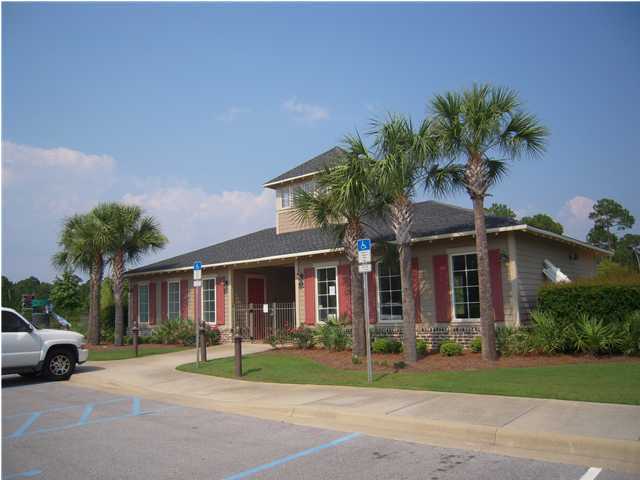 75 Red Maple Court Santa Rosa Beach, FL 32459 - Photo 6 of 8 a front view of a house with a yard and garage