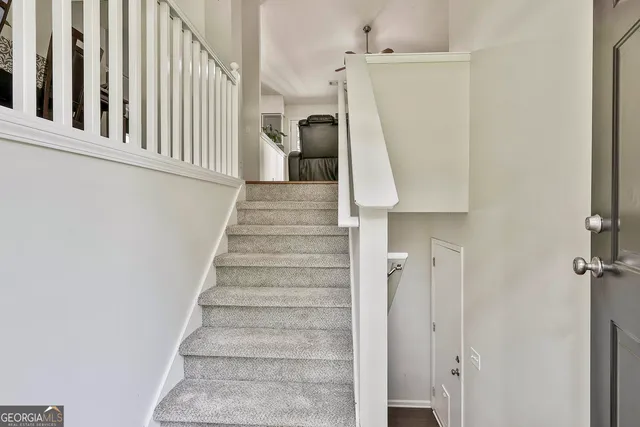 a view of a livingroom with furniture window and wooden floor
