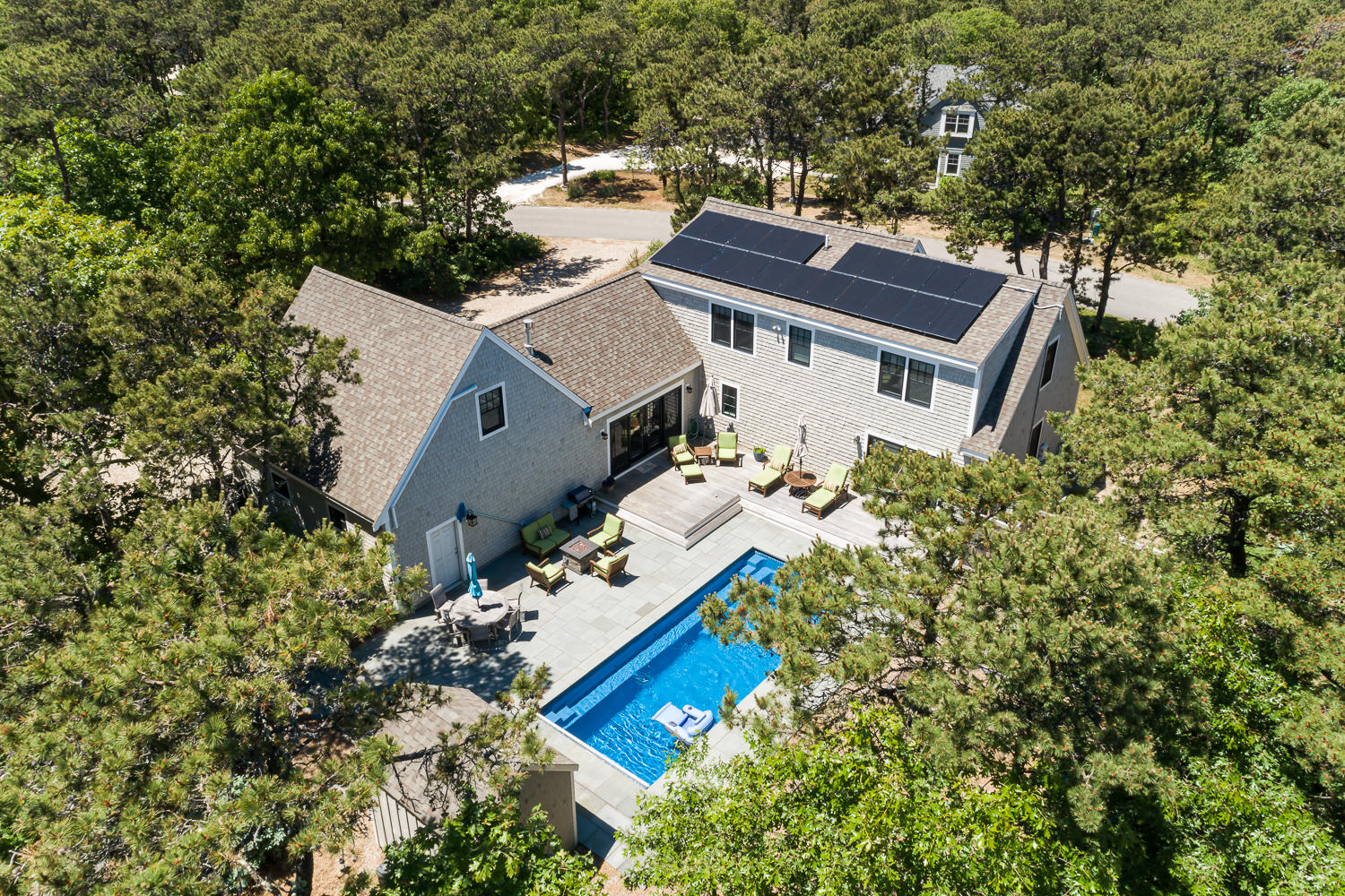 an aerial view of a house with a yard and garden
