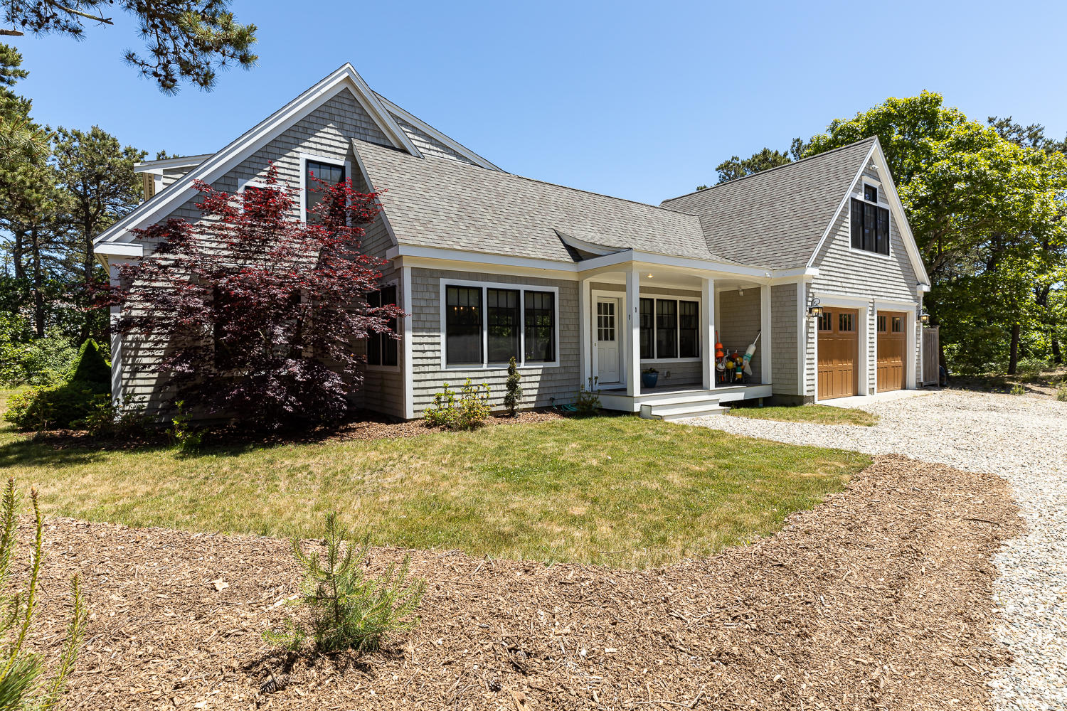 1 Yellow Brick Road Truro, MA 02666 - Photo 2 of 34 a front view of a house with a yard