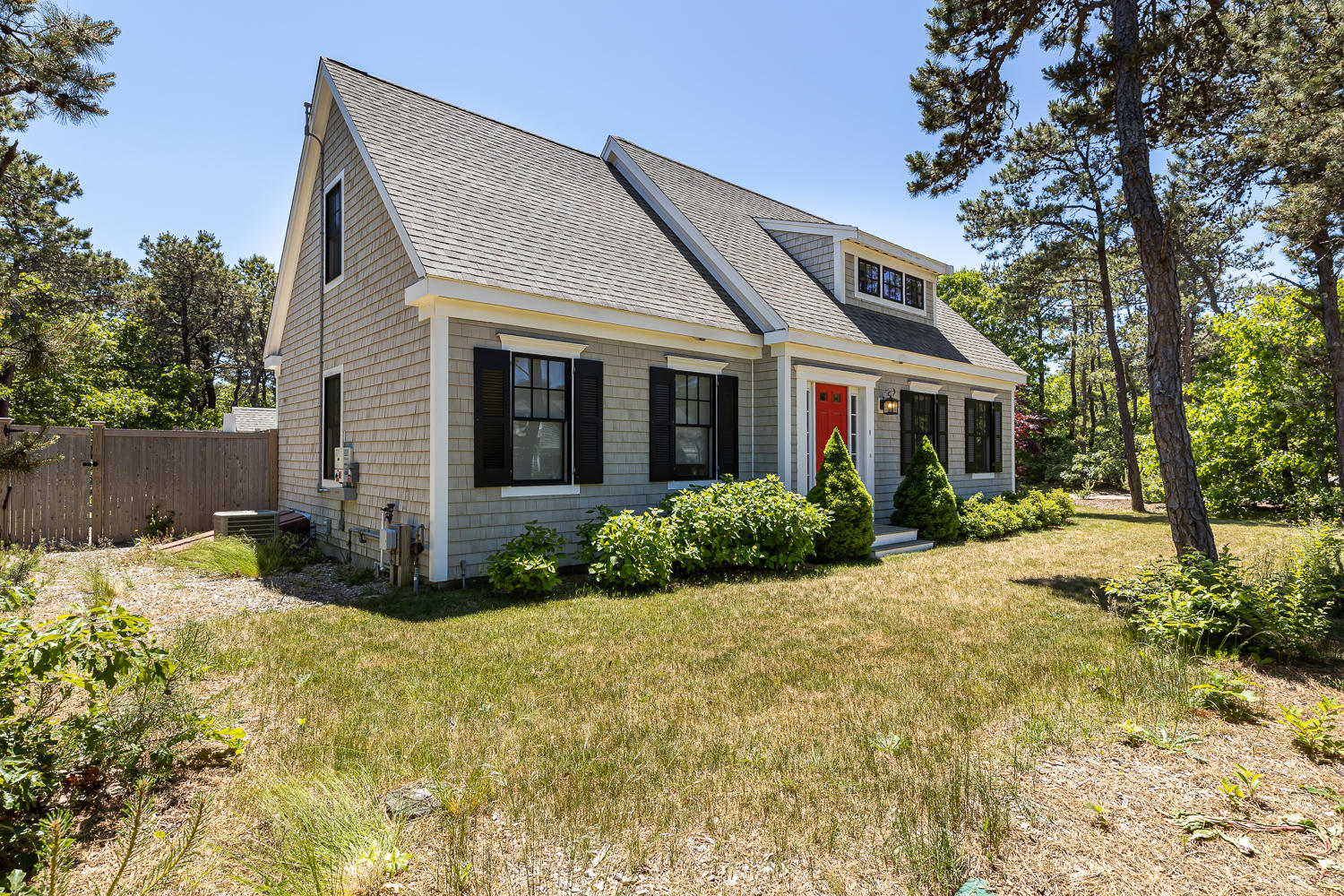 1 Yellow Brick Road Truro, MA 02666 - Photo 4 of 34 front view of a house with a yard