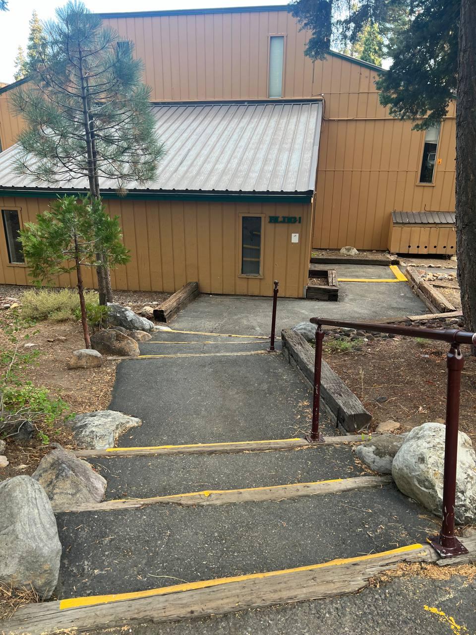 1300 Regency Way, Unit 44 Tahoe Vista, CA 96148 - Photo 23 of 25 a view of a patio with table and chairs with wooden fence