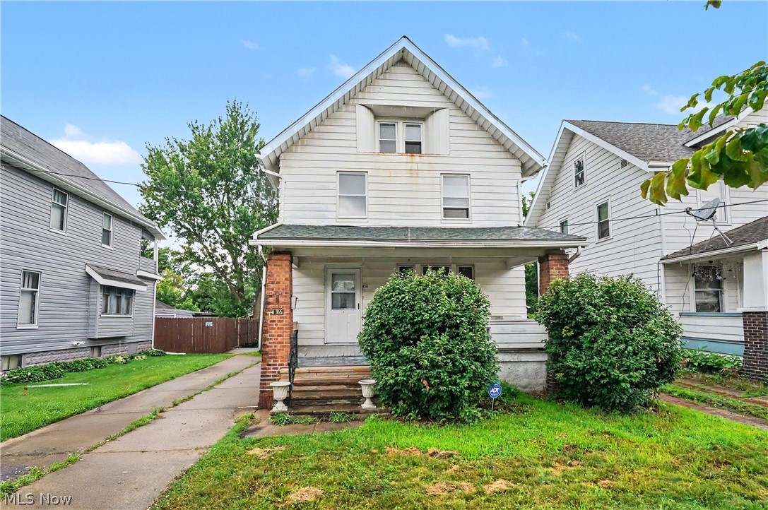 456 Delmar Avenue Akron, OH 44310 - Photo 1 of 27 Two-story residence featuring a covered front porch with brick pillars, a gabled roofline, and a concrete driveway