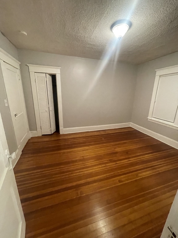 49 Rittenhouse Terrace, Unit 1 Springfield, MA 01108 - Photo 5 of 5 an empty room with wooden floor