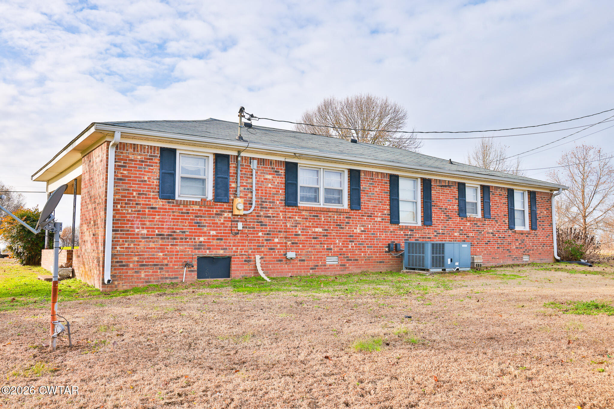 32 New Hope Road Dyer, TN 38330 - Photo 13 of 28 a front view of a house with a yard
