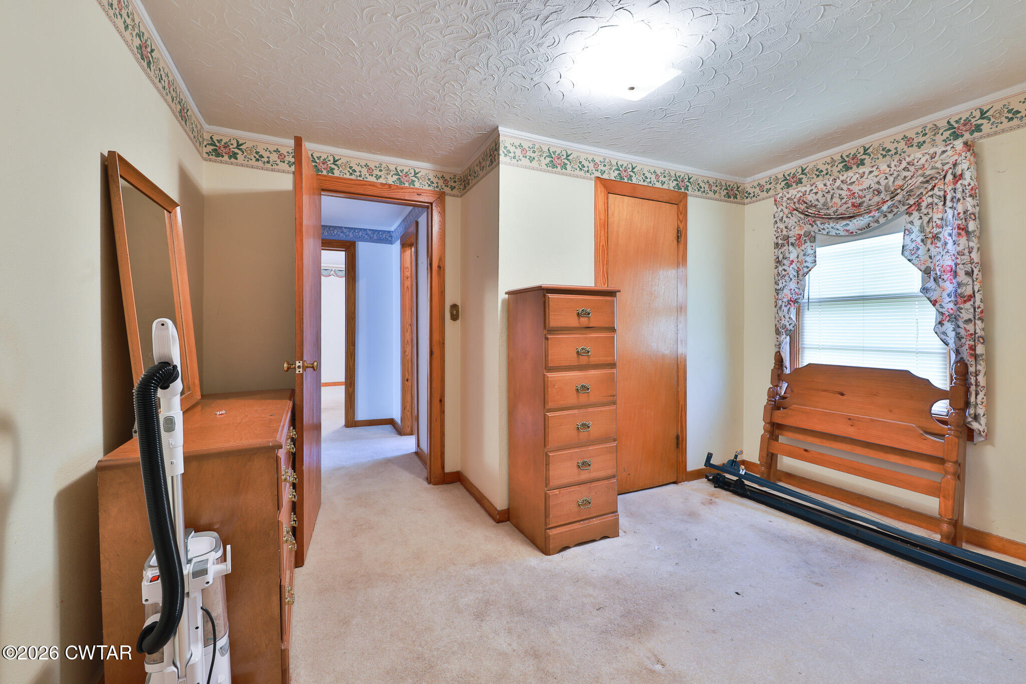 32 New Hope Road Dyer, TN 38330 - Photo 25 of 28 a bedroom with a dresser and a window