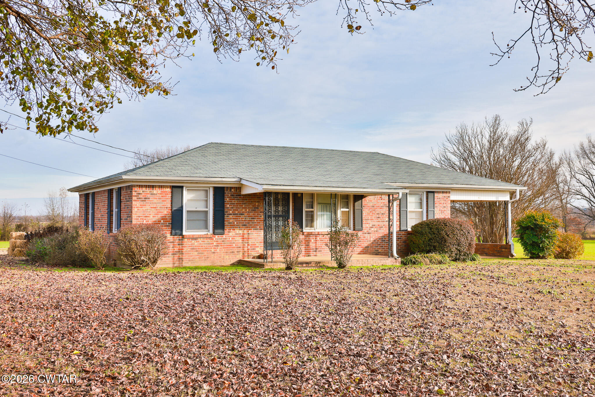 32 New Hope Road Dyer, TN 38330 - Photo 7 of 28 a front view of a house with a yard