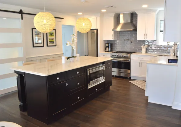 a kitchen with a sink cabinets and window