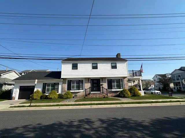 a front view of a building with that a table and chairs