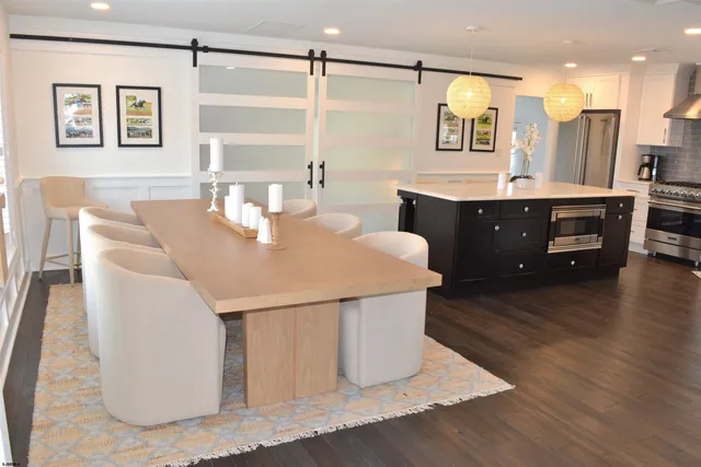 a living room with a sink and a table