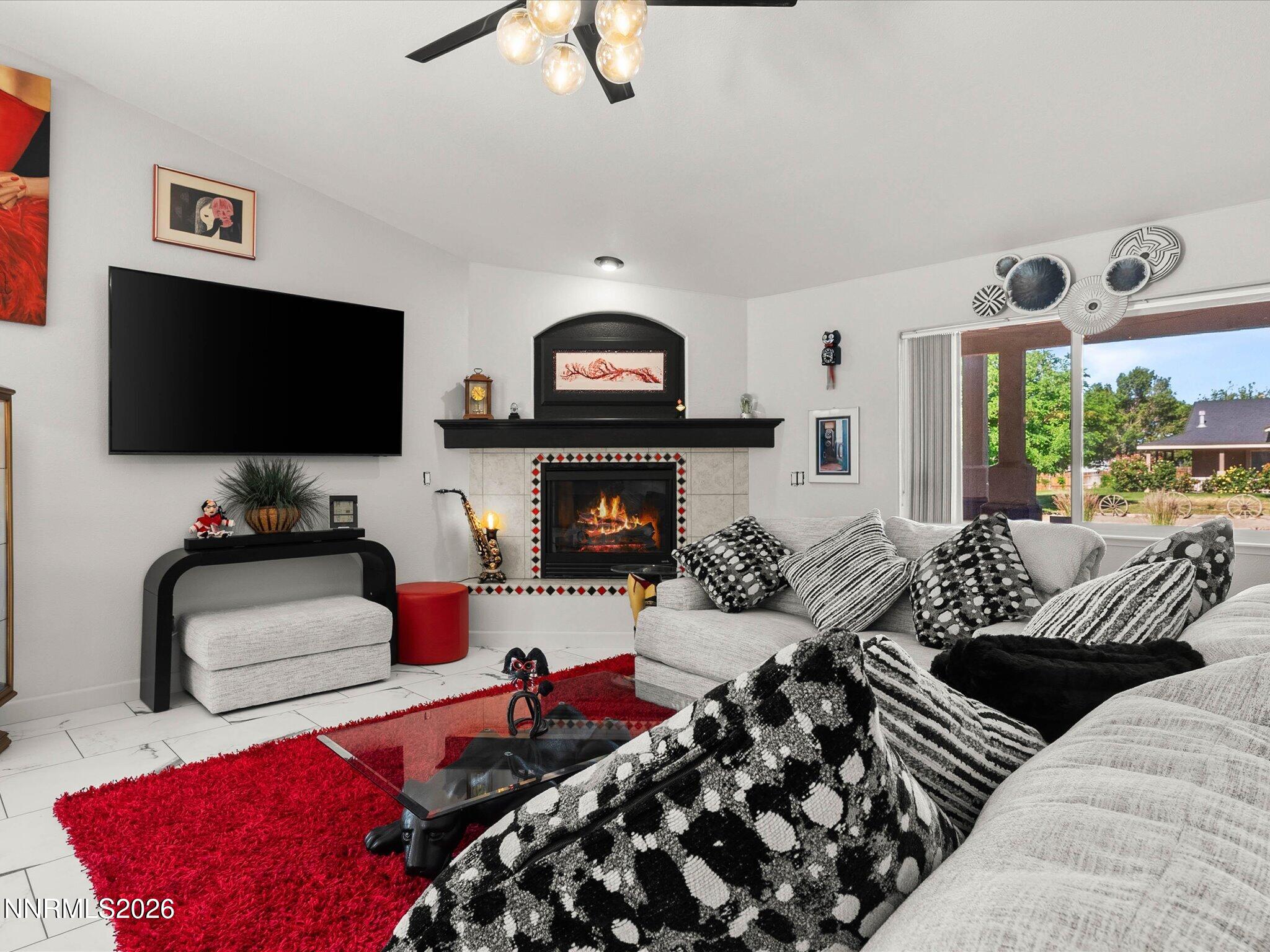 1080 Red Rock Road Fernley, NV 89408 - Photo 10 of 45 a living room with furniture and a flat screen tv