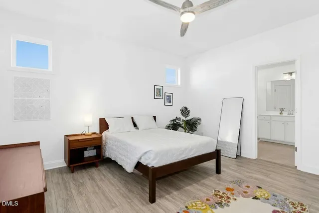 a bathroom with double sink and a mirror