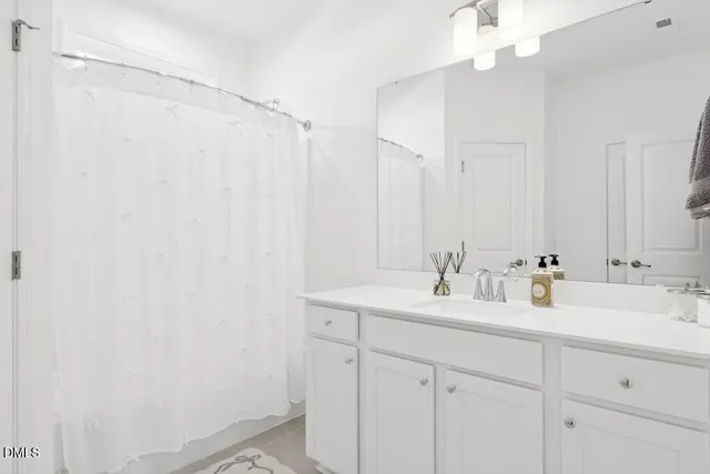 a view of a workspace with a window and couch