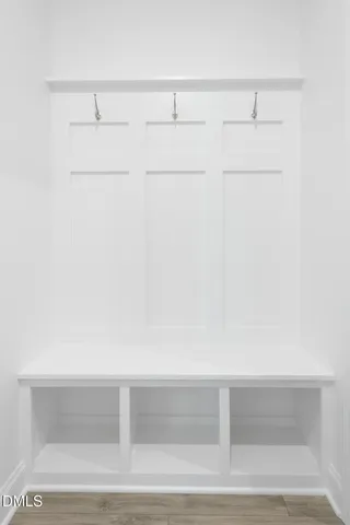 a front view of a house with a garden and patio