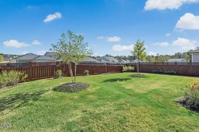 an aerial view of a house with outdoor space