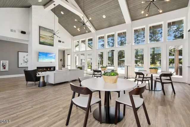 a room with furniture and view of kitchen