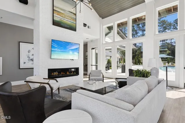 a dining room with furniture a rug and a painting