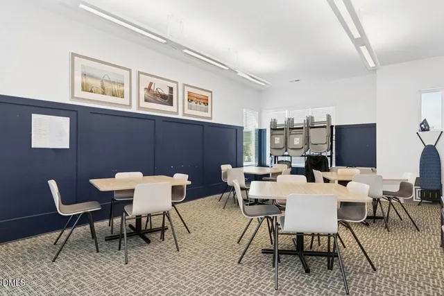 a view of a room with gym equipment and a window