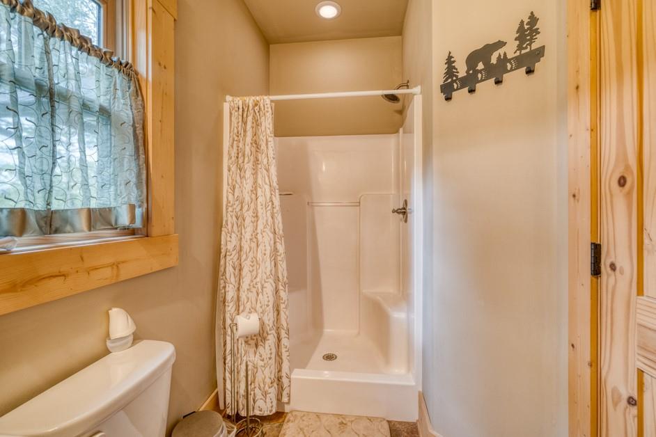 111 Watkins Farm Road Blue Ridge, GA 30513 - Photo 11 of 23 a bathroom with a shower and a toilet