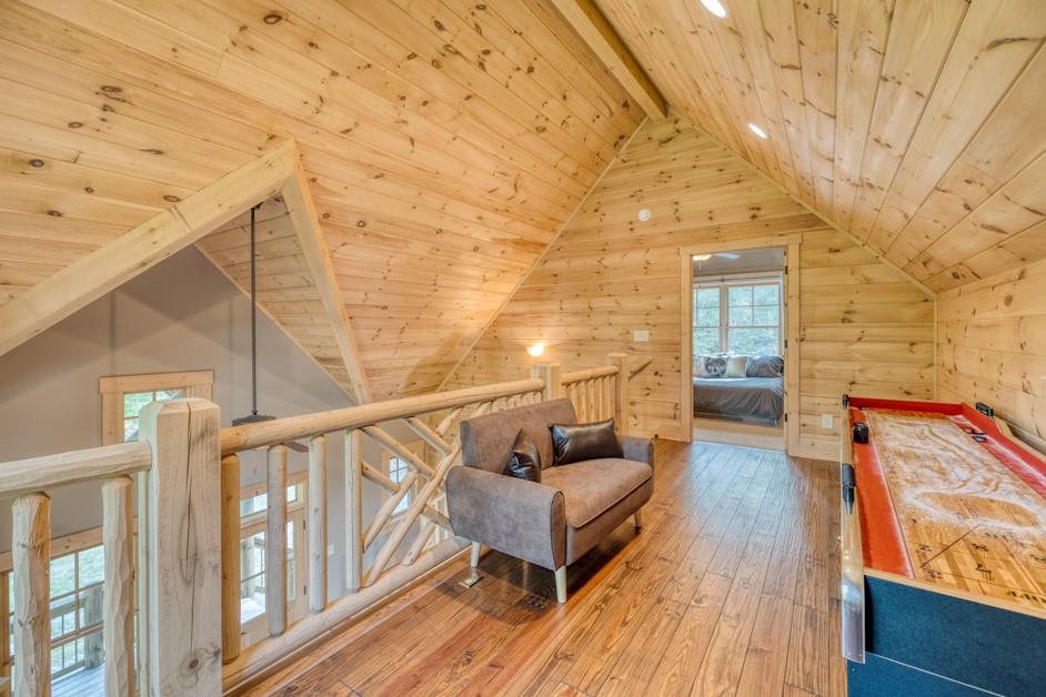 111 Watkins Farm Road Blue Ridge, GA 30513 - Photo 14 of 23 a balcony with wooden floor and outdoor seating