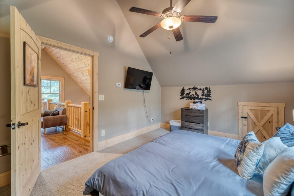 111 Watkins Farm Road Blue Ridge, GA 30513 - Photo 16 of 23 a bedroom with furniture and a mirror
