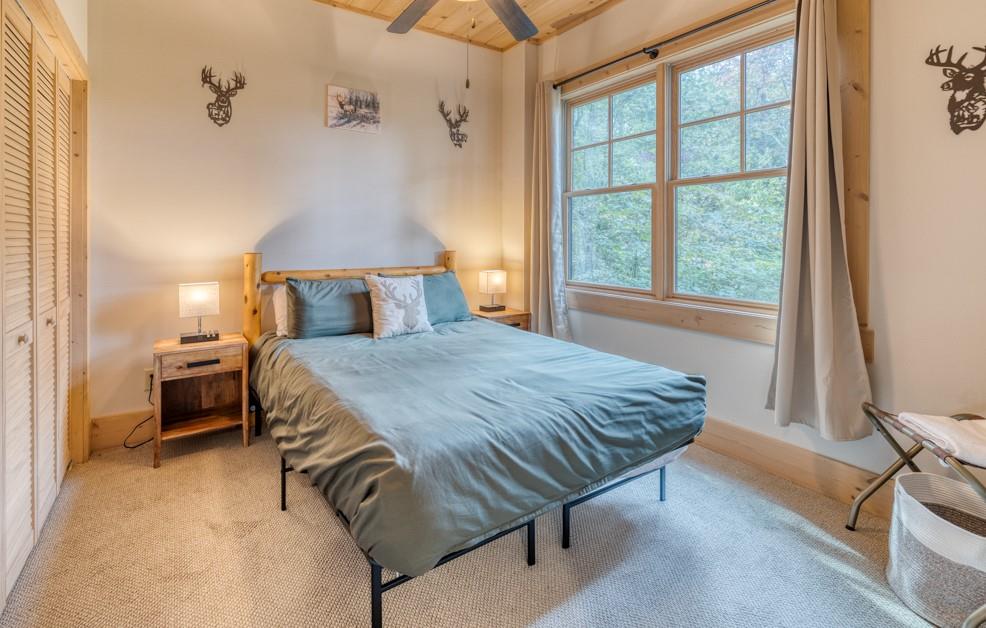 111 Watkins Farm Road Blue Ridge, GA 30513 - Photo 20 of 23 a bedroom with a bed and a window