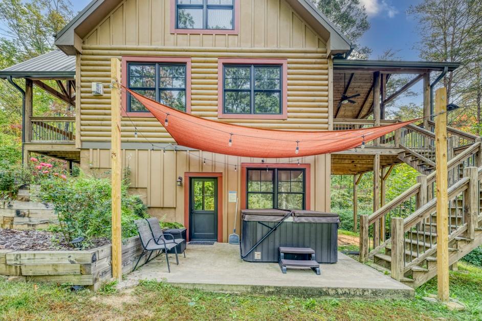 111 Watkins Farm Road Blue Ridge, GA 30513 - Photo 2 of 23 front view of a house with a chairs and table in a patio