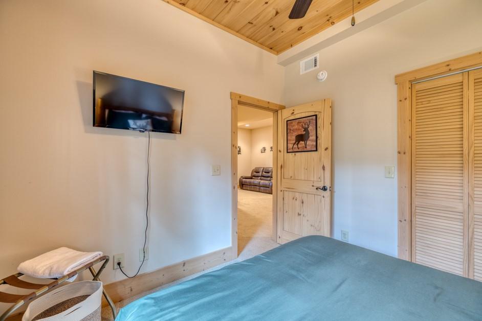 111 Watkins Farm Road Blue Ridge, GA 30513 - Photo 21 of 23 a view of a livingroom with wooden floor and a flat screen tv