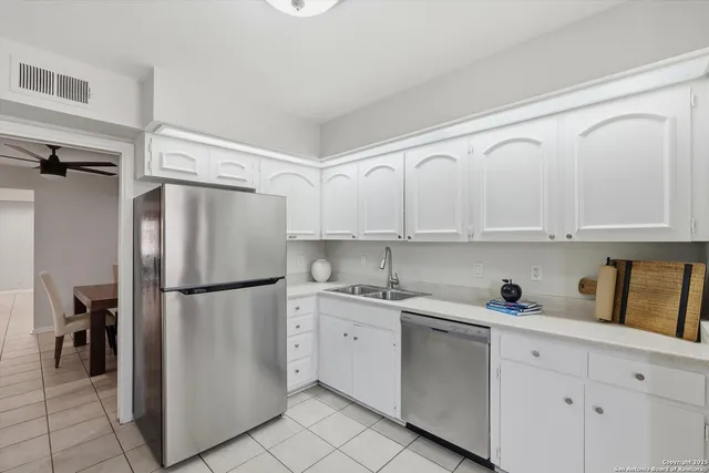 a spacious bedroom with a bed and a window