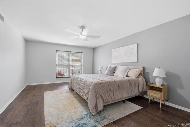 a bathroom with a shower sink and mirror