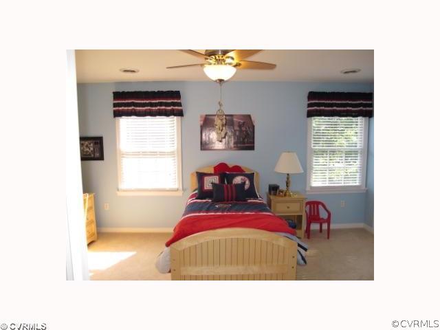 15219 Windy Ridge Road Midlothian, VA 23112 - Photo 10 of 12 a living room with furniture and a window