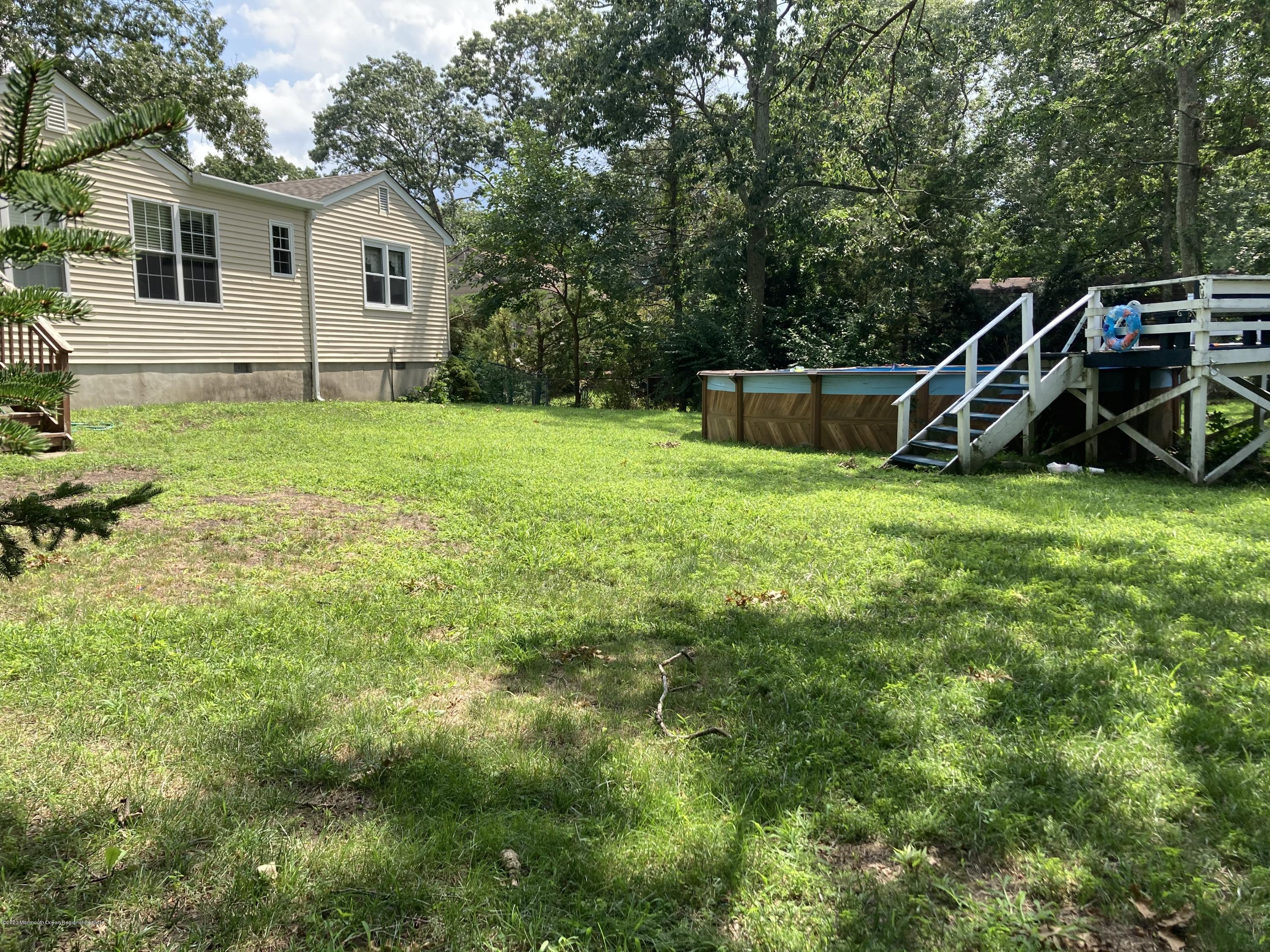27 Pine Road Howell, NJ 07731 - Photo 3 of 4 a view of a house with backyard